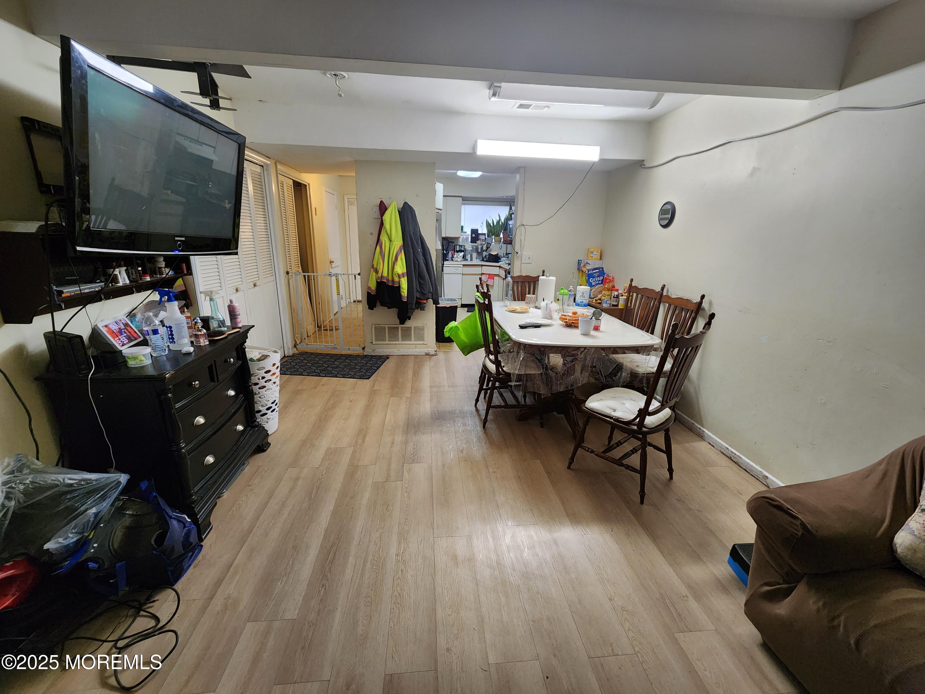 1102 Sawmill Road, Unit 99 Brick, NJ 08724 - Photo 5 of 13 a living room with furniture and a flat screen tv