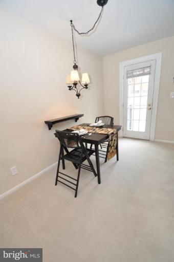 4620 28th Road South, Unit B Arlington, VA 22206 - Photo 13 of 18 a dining room with a table and chairs