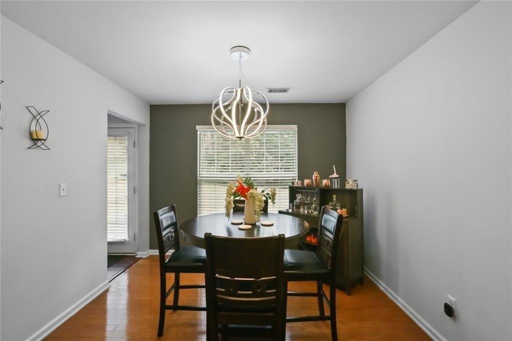 1464 Gates Circle Southeast Atlanta, GA 30316 - Photo 13 of 26 a view of a dining room with furniture window and wooden floor