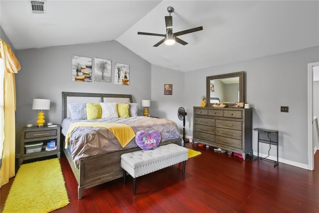 1464 Gates Circle Southeast Atlanta, GA 30316 - Photo 22 of 26 a bedroom with a bed and wooden floor