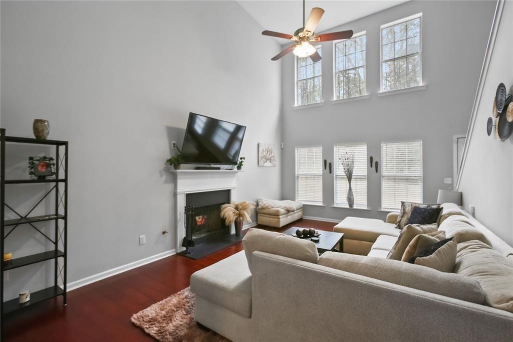 1464 Gates Circle Southeast Atlanta, GA 30316 - Photo 8 of 26 a living room with furniture a fireplace and a flat screen tv