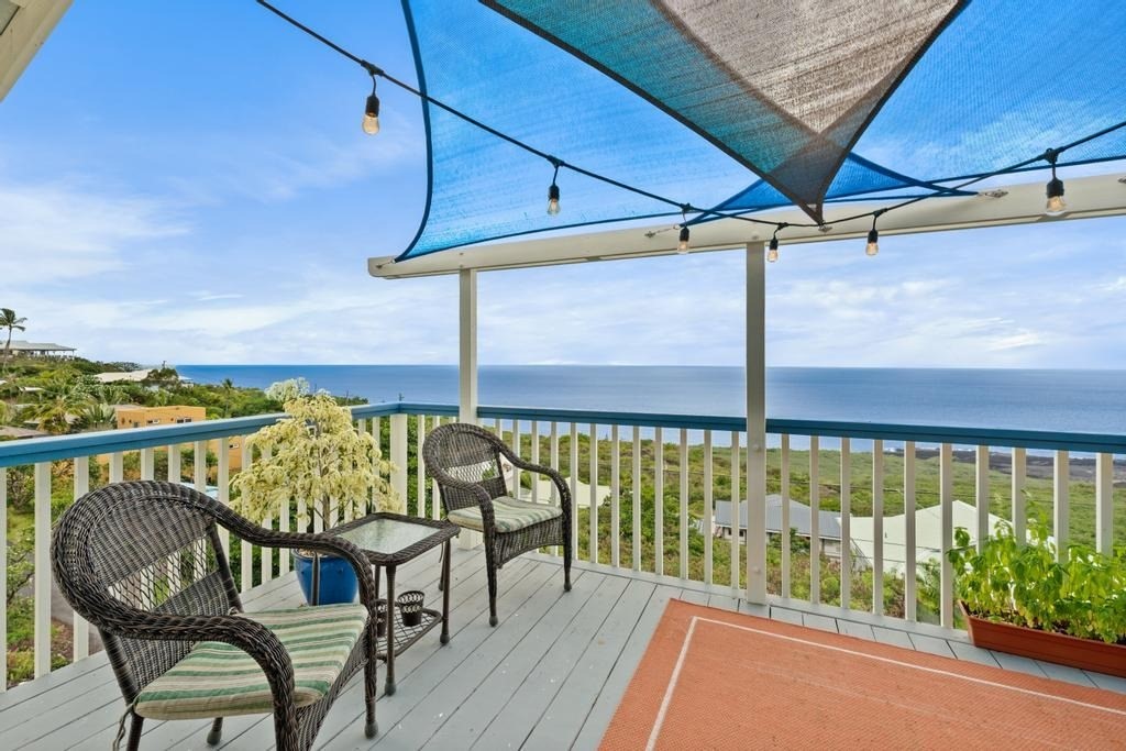 87-3210 Rd G Captain Cook, HI 96704 - Photo 2 of 20 a view of a balcony with chairs
