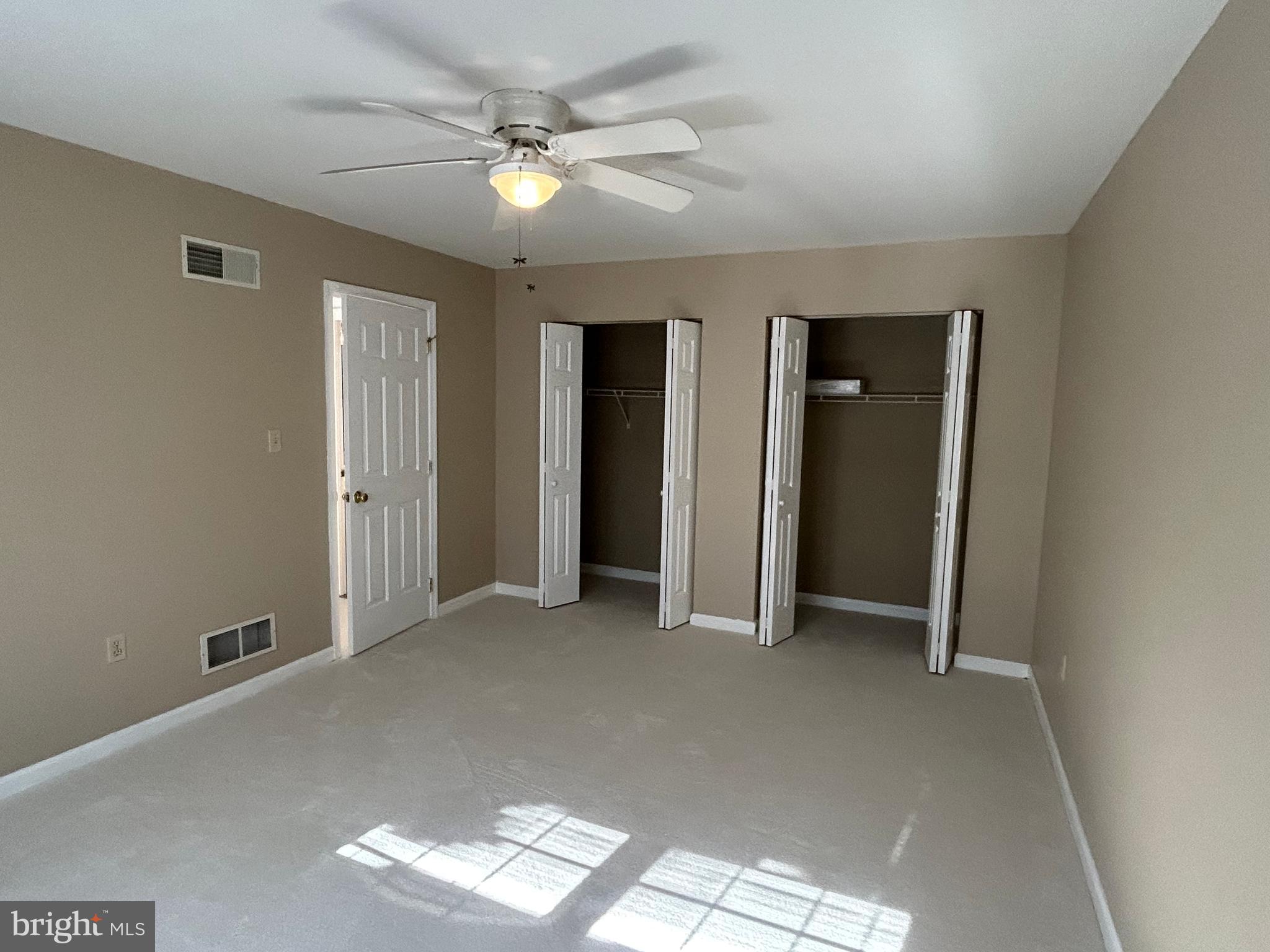 3056 Solar Drive Dover, PA 17315 - Photo 28 of 43 an empty room with closet and a ceiling fan