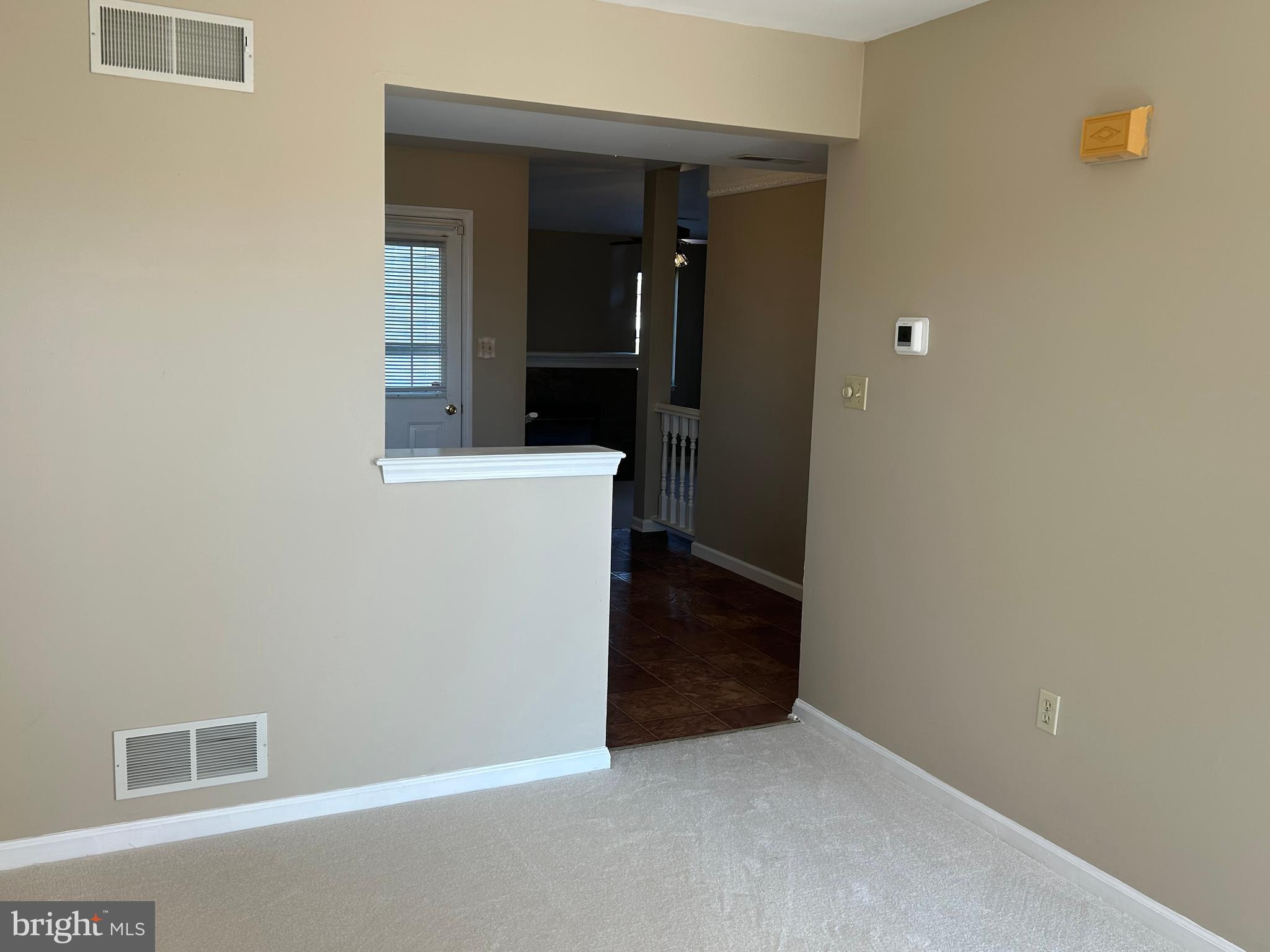 3056 Solar Drive Dover, PA 17315 - Photo 5 of 43 a view of a hallway with wooden cabinets and a refrigerator