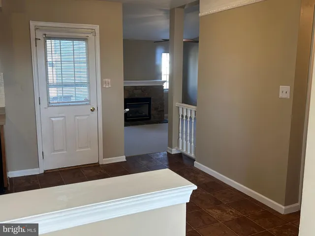 a kitchen with a sink and a stove top oven