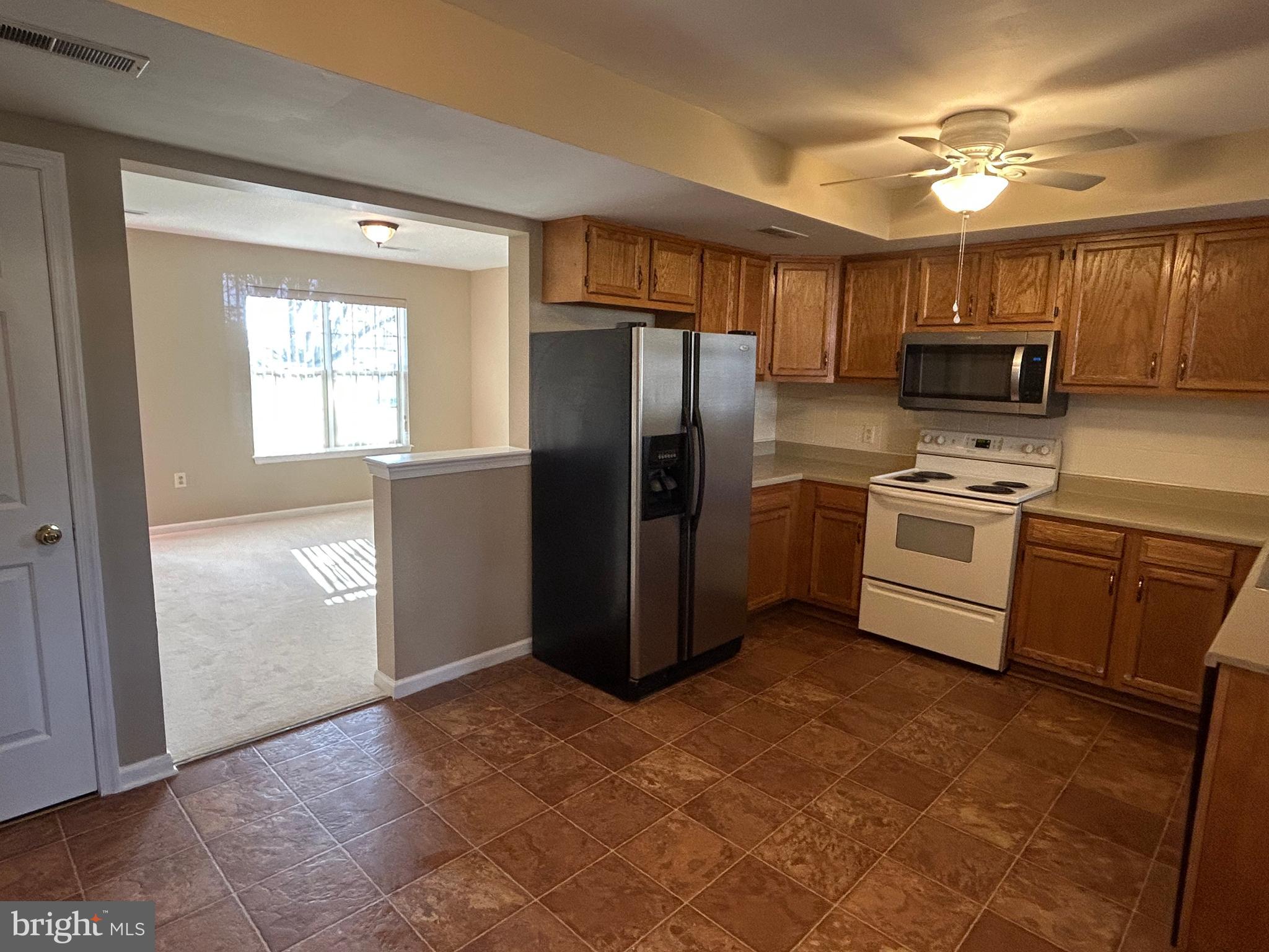 3056 Solar Drive Dover, PA 17315 - Photo 8 of 43 a kitchen with a refrigerator sink and cabinets