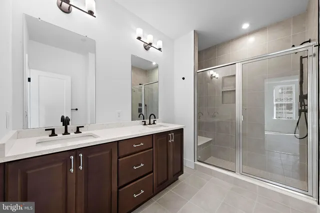 a bathroom with a glass shower door