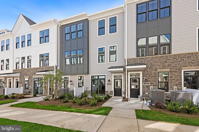 a front view of a building with garden