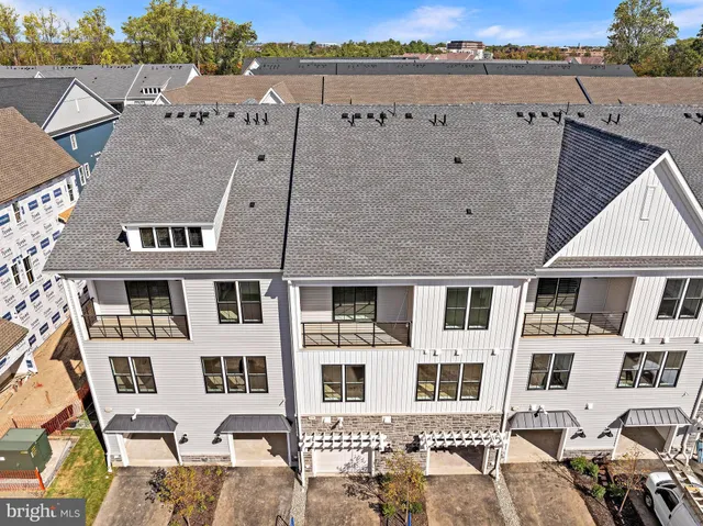 an aerial view of residential building with parking
