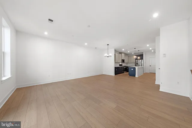 a view of kitchen and refrigerator