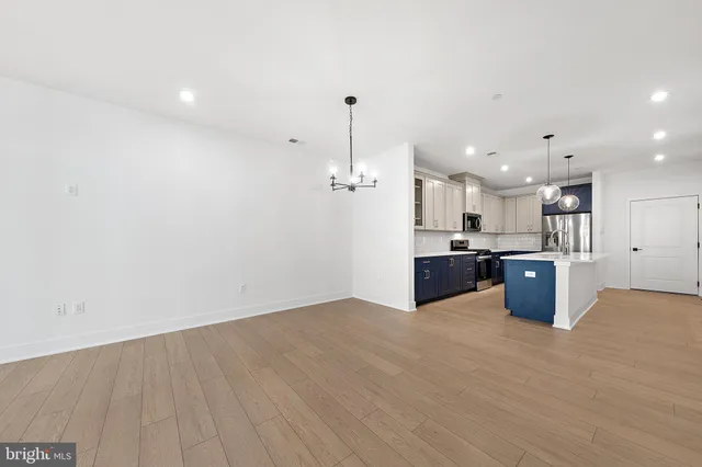 a kitchen with a sink and cabinet