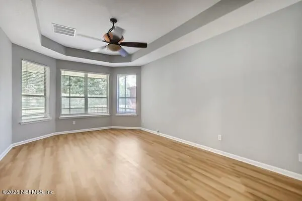 a view of an entryway with wooden floor