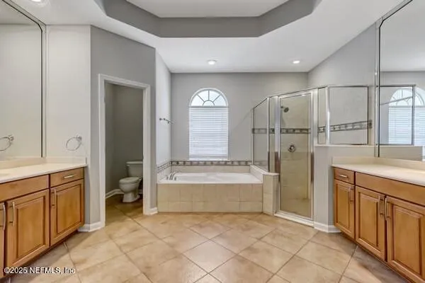 a view of a hallway with a chandelier and chandelier