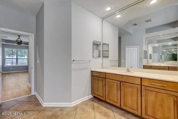 a view of a big room with closet and windows