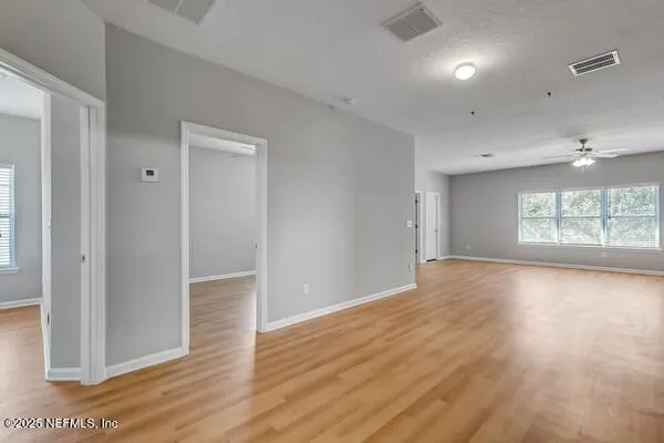 a bathroom with a granite countertop sink tub and a mirror