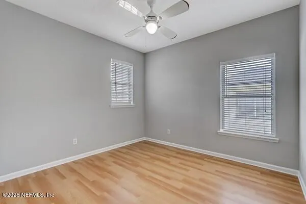 a kitchen with granite countertop a sink cabinets and a window