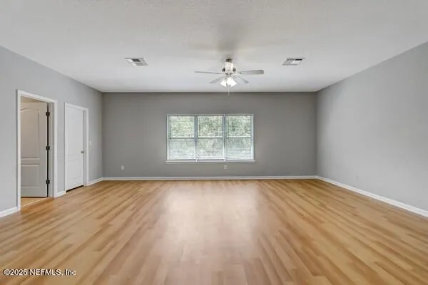 a kitchen with stainless steel appliances granite countertop a refrigerator stove top oven and sink