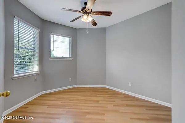 a view of kitchen with stainless steel appliances granite countertop a refrigerator a stove and a sink