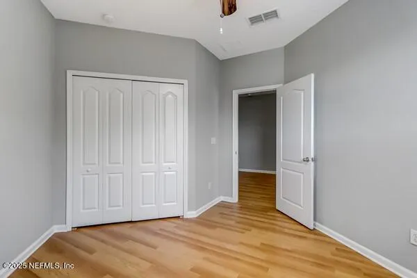 a kitchen with stainless steel appliances granite countertop a stove top oven a sink dishwasher and a refrigerator