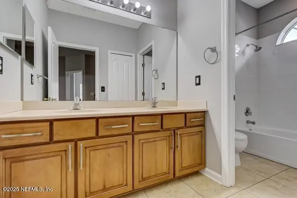 a kitchen with stainless steel appliances granite countertop cabinets and a stove top oven