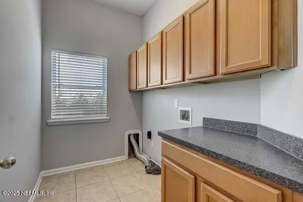 a kitchen with stainless steel appliances granite countertop a stove microwave and cabinets