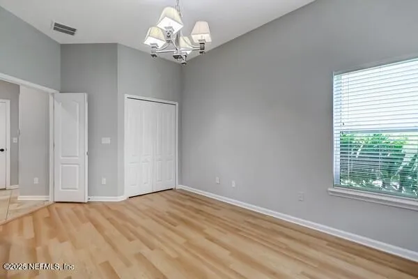 a kitchen with stainless steel appliances granite countertop a sink and a refrigerator