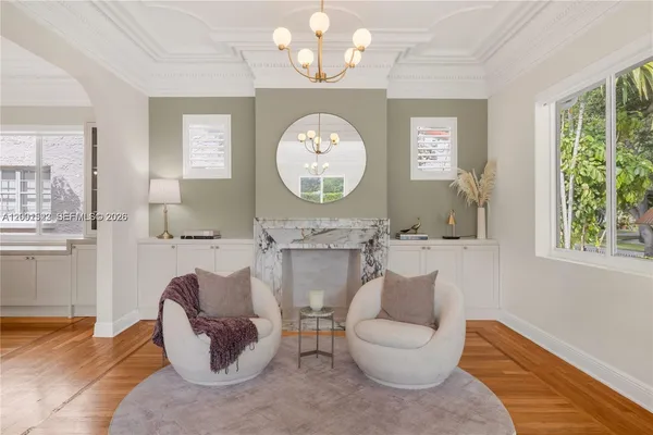 a view of a dining room with furniture window and wooden floor