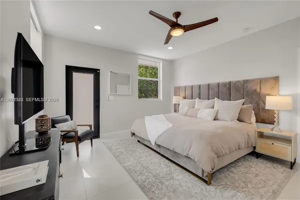 a bedroom with a bed and a desk