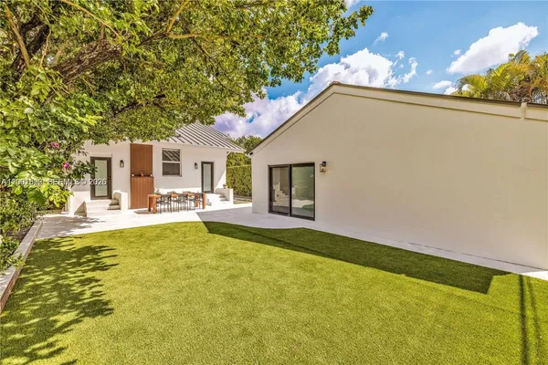 a view of a swimming pool with a patio