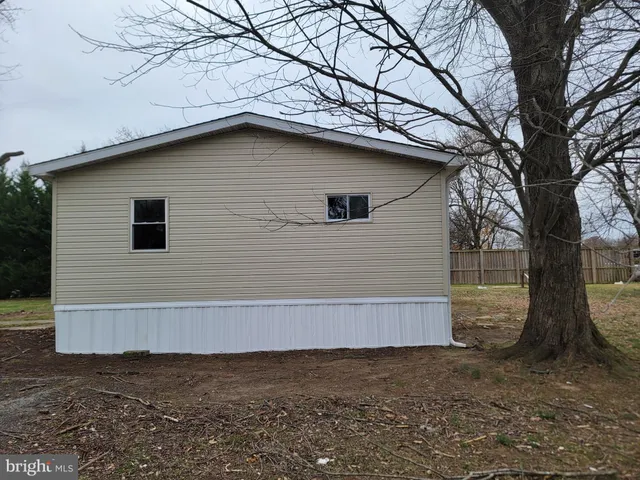 a house with a tree in the background