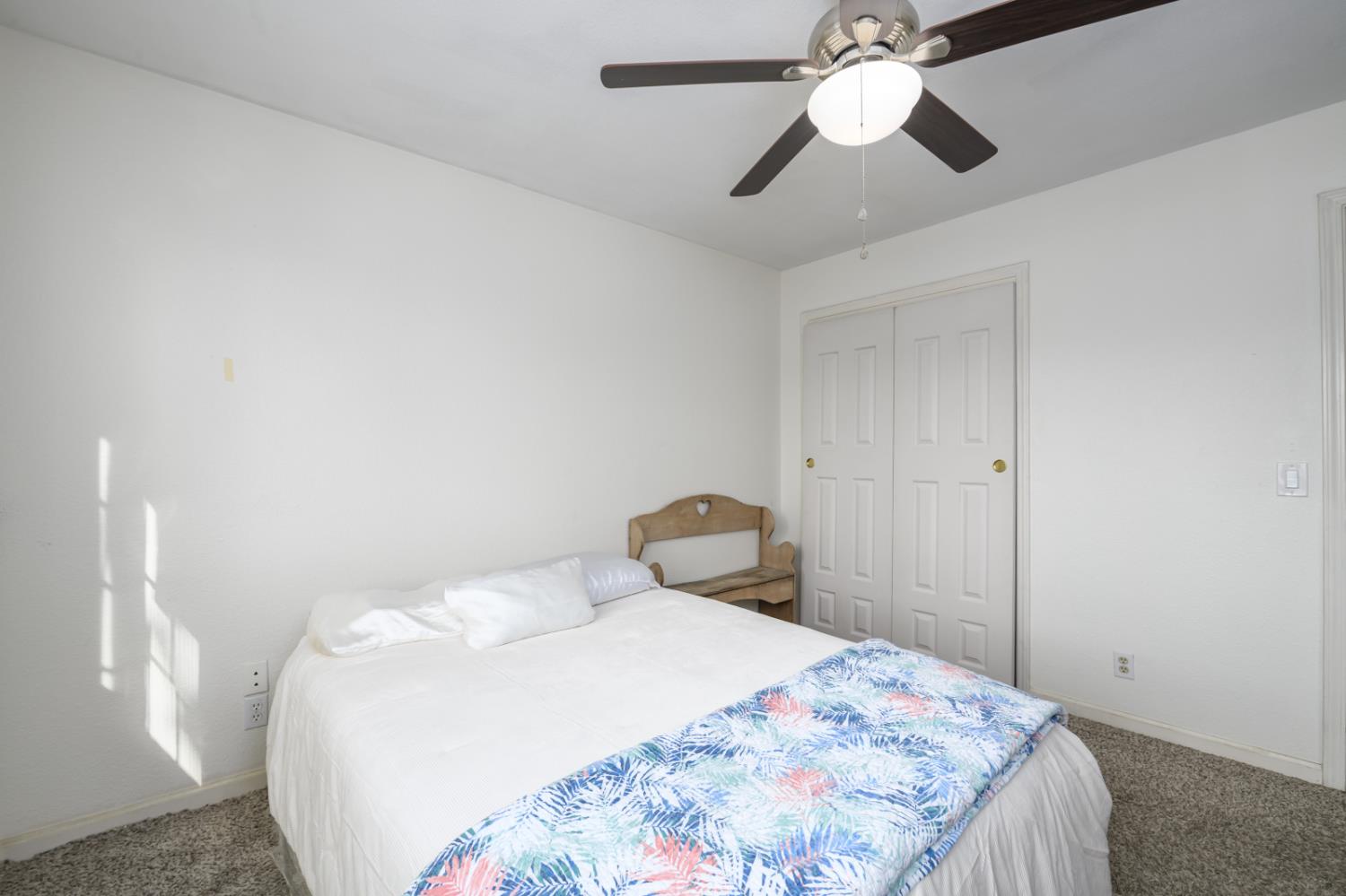 672 Allen Court Placerville, CA 95667 - Photo 11 of 17 a bedroom with a bed and a chandelier