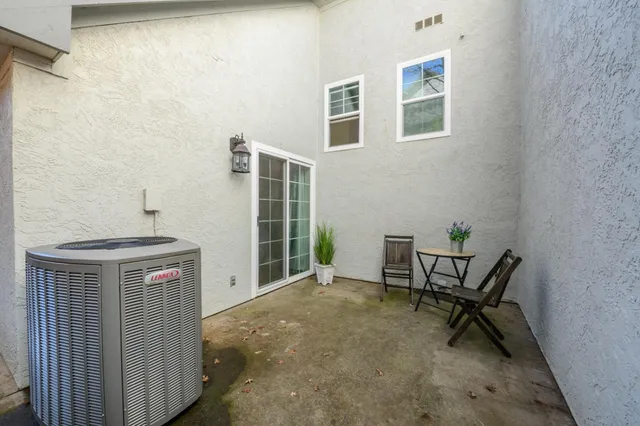 a view of a house with porch and sitting area