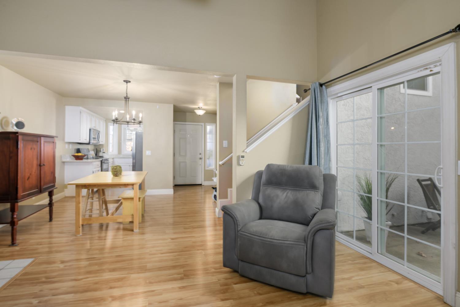 672 Allen Court Placerville, CA 95667 - Photo 8 of 17 a living room with furniture a dining table and a large window