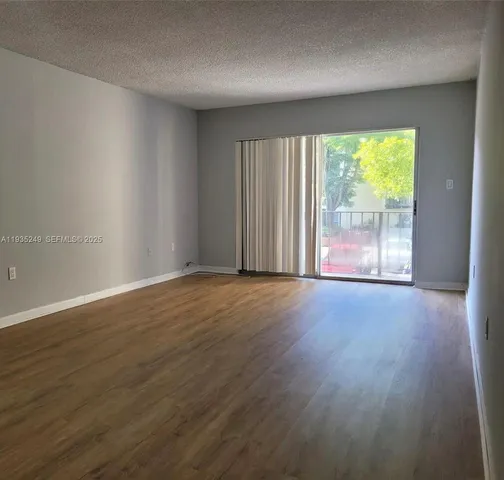 a kitchen with a sink cabinets and window