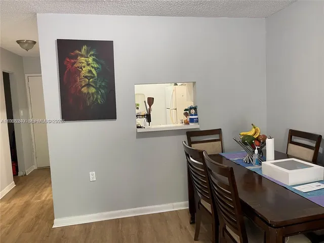 a view of room with wooden floor