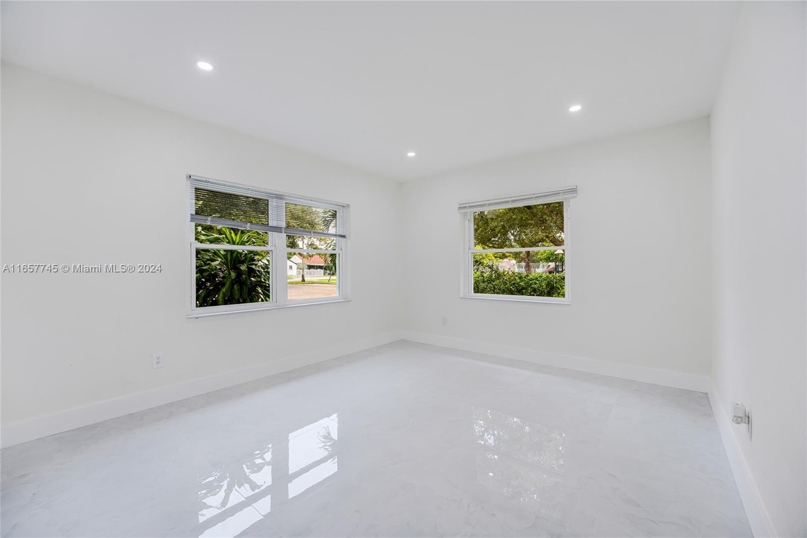 4802 Northwest 11th Avenue Miami, FL 33127 - Photo 11 of 26 an empty room with windows