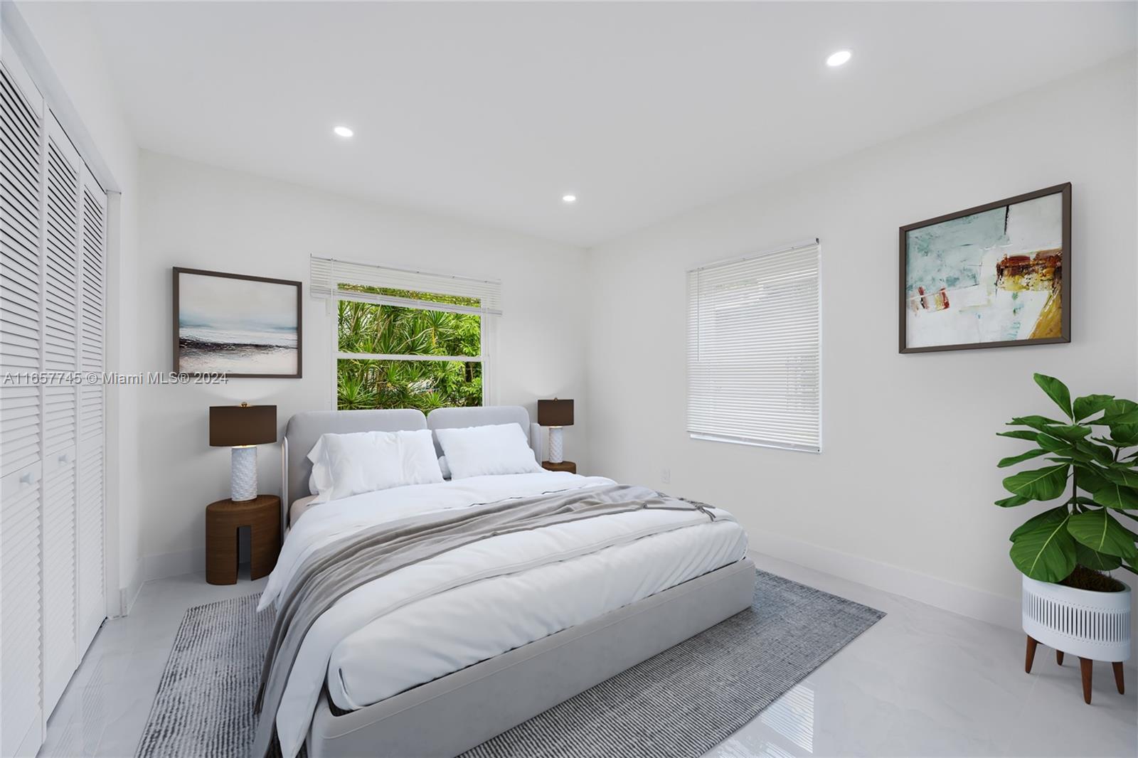 4802 Northwest 11th Avenue Miami, FL 33127 - Photo 14 of 26 a bedroom with a bed and a painting on the wall