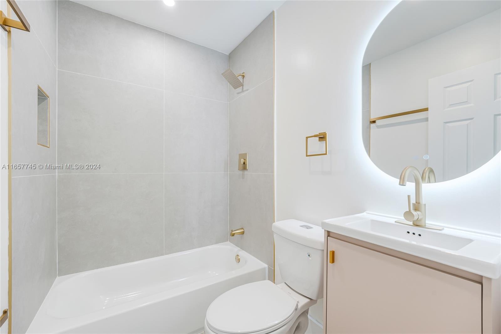 4802 Northwest 11th Avenue Miami, FL 33127 - Photo 17 of 26 a bathroom with a sink toilet and shower