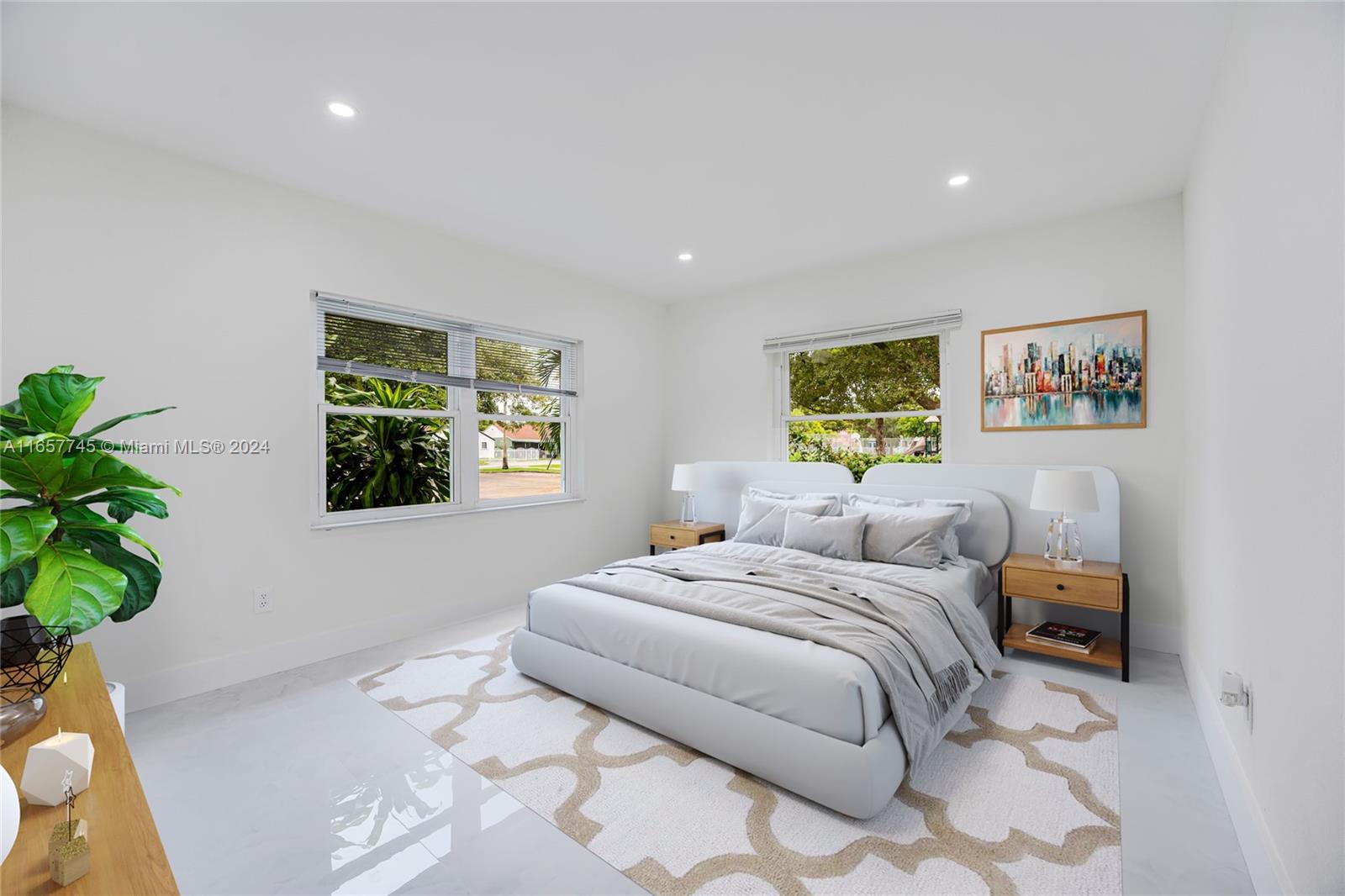 4802 Northwest 11th Avenue Miami, FL 33127 - Photo 20 of 26 a bedroom with a bed and a potted plant