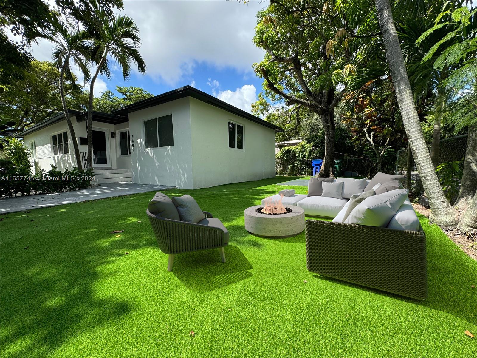4802 Northwest 11th Avenue Miami, FL 33127 - Photo 23 of 26 a view of a house with backyard and a garden
