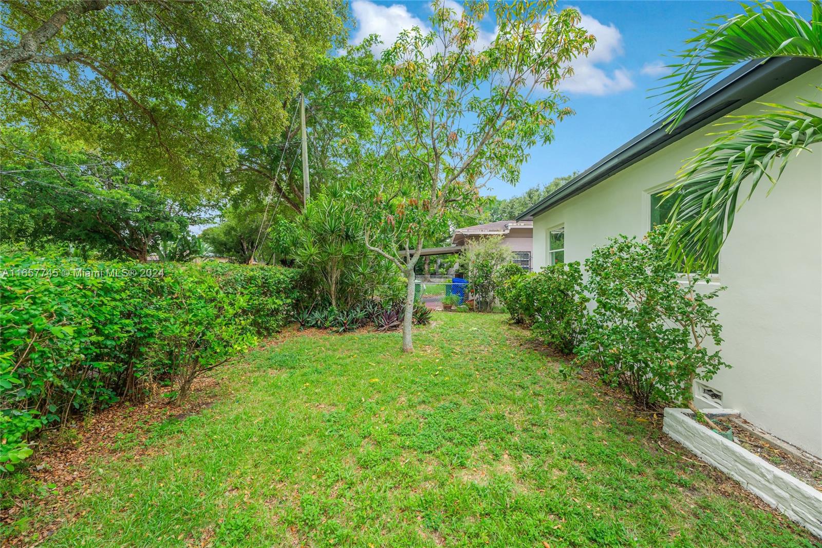4802 Northwest 11th Avenue Miami, FL 33127 - Photo 25 of 26 a green field with lots of bushes