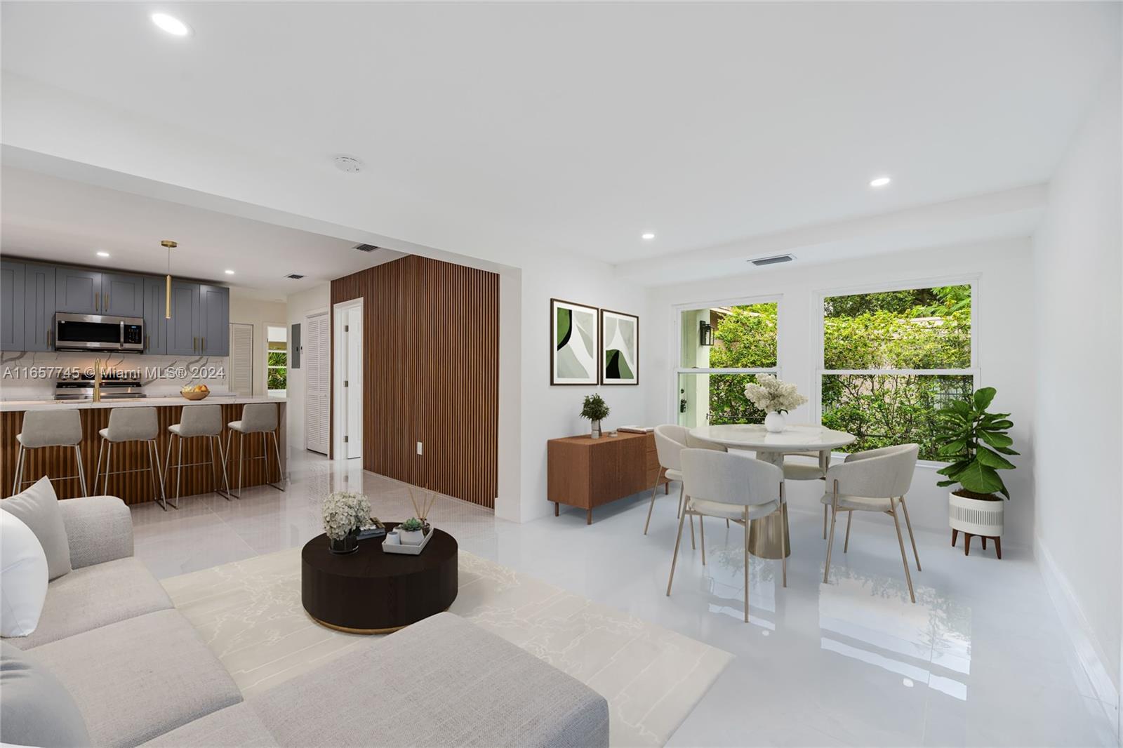 4802 Northwest 11th Avenue Miami, FL 33127 - Photo 3 of 26 a living room with furniture and a large window