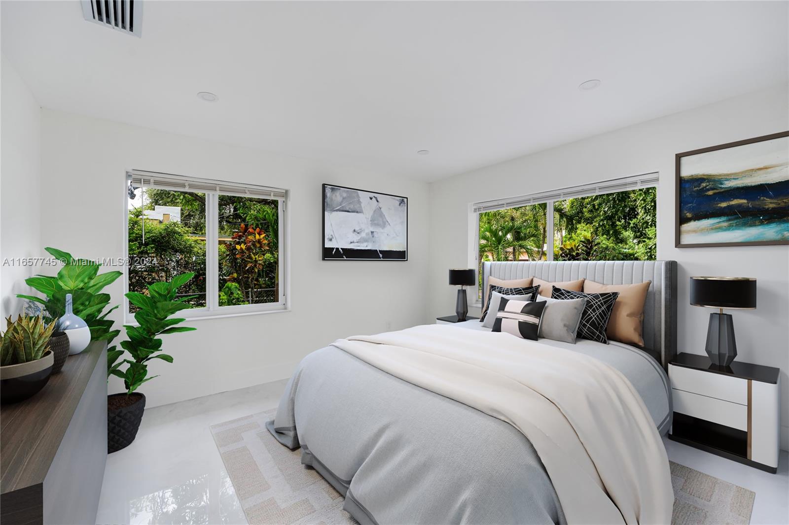 4802 Northwest 11th Avenue Miami, FL 33127 - Photo 10 of 26 a bedroom with bed and a potted plant