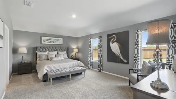 a living room with furniture kitchen view and a flat screen tv