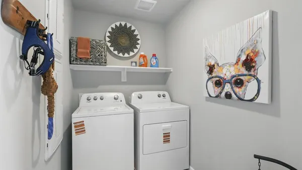 a work place with computer on desk and chair