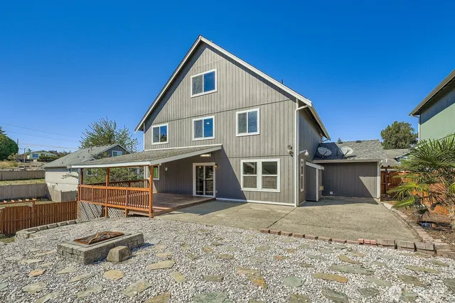 a front view of a house with a wooden fence