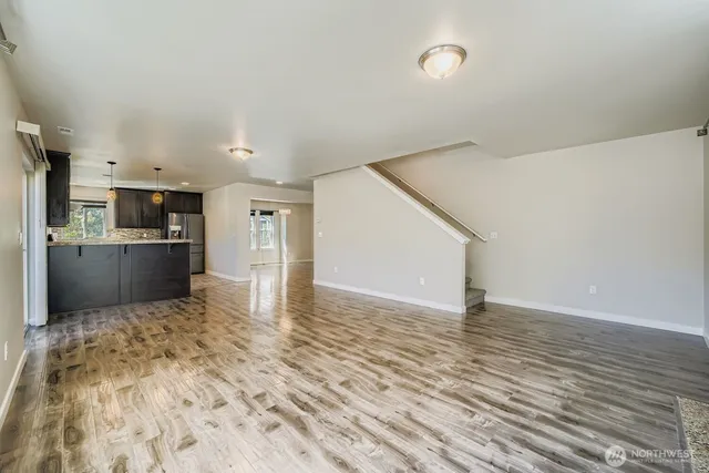 a view of kitchen with cabinets