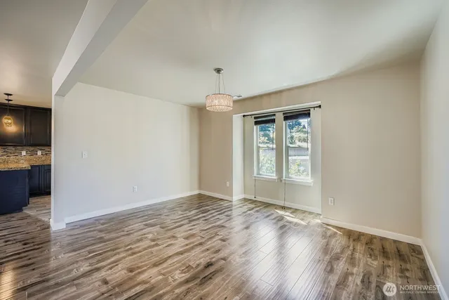 a view of livingroom with hardwood floor and hallway