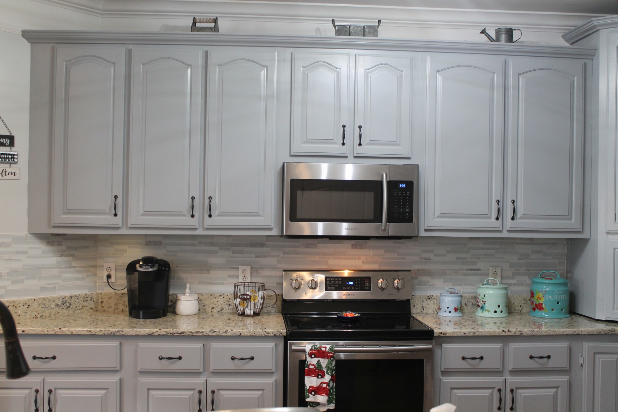 3387 Kinneys Road Cedar Hill, TN 37032 - Photo 16 of 43 a kitchen with white cabinets and appliances