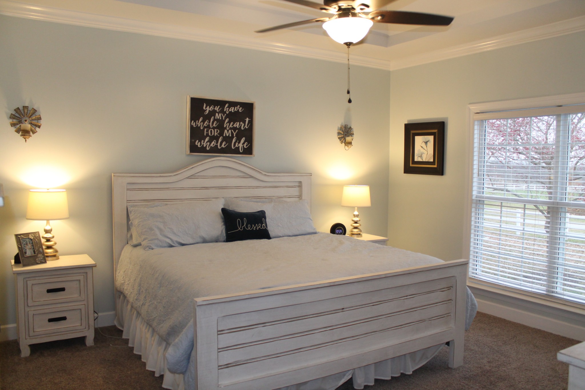 3387 Kinneys Road Cedar Hill, TN 37032 - Photo 27 of 43 a bedroom with a bed and a chandelier
